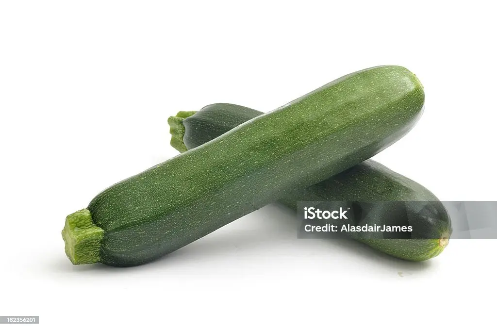 Two courgettes isolated on white.